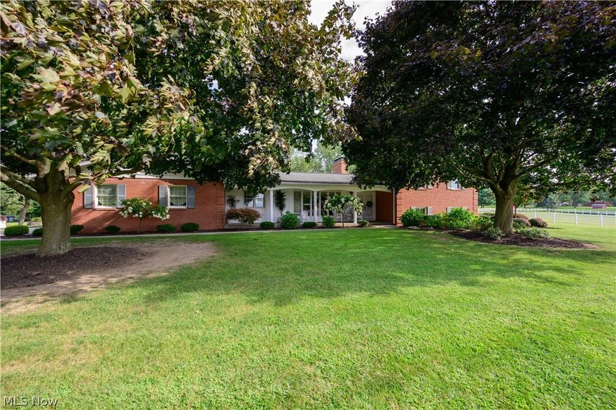 Amazing property was built by the owners; they have loved this home & taken meticulous care of it. Brick/vinyl home features 3 bedrooms & 2 full/2 half baths, newer windows,security system. F.room w/rough sawn oak beams/walls, L/D room w/built in china cabinet w/lighting. Kitchen w/oak cabinets & newer appliances; adjacent to laundry room. 2nd floor M.BR w/dressing room, his/her double closets,vinyl/azech balcony overlooking gorgeous rear outside views, & private bath.Two other BR's /full bath on 2nd floor. L.level finished w/above ground windows,wet bar, & half bath.Stunning property sits on almost 11.63 acres; pristine conditon grounds w/ paver sidewalks and rear patio, beautiful trees/landscaping. 58x48 barn w/2nd floor loft,concrete floors,animal pens w/4 inch curbs, 2 overhead doors,100 amp elec. box,water accessibility throughout barn,electric conduit throughout barn,propane furnace,1 ton monorail hoist,2-16 ft.rear sliding doors, lighting in barn,hinged stairwell,security system.1300 ft.white vinyl fence around barn area; 30x30 basketball court. 95 ft.well w/submersible pump,2-1000 gal.septic system tanks/12 sq. ft. leach lines. Stunning property.