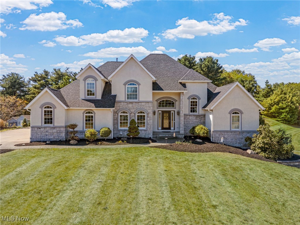 Here’s your chance to own a quality built home with over 3700 square feet of living space, complete with a remarkable 32 x 88 pole building with electric, water, gas heat, and newer roof and doors. Step through the front door into a 2 story foyer that opens to a vaulted great room with a striking floor to ceiling fireplace. Hardwood floors flow into the stunning eat in kitchen with granite counters, black stainless appliances including a double oven, pantry, and breakfast bar. Just steps away, the formal dining room with crown molding and chair rail is perfect for gatherings and holidays. A first floor laundry and half bath are tucked conveniently near the entry from the attached 3 car garage.
The main floor primary suite is a private retreat with a walk in closet and an en suite featuring a corner shower and double sink vanity. Upstairs, a catwalk overlooking the great room connects three spacious bedrooms and a remodeled full bath with a tile shower and vessel sink vanity.
The finished lower level is designed for entertaining with a media room featuring stadium seating, a kitchenette with bar, and a full bath with oversized shower plus a built in sauna.
Head outside where you’ll find a patio with firepit and over an acre of land with potential for a pool and generous space for outdoor living. This one has it all—schedule your private showing today.