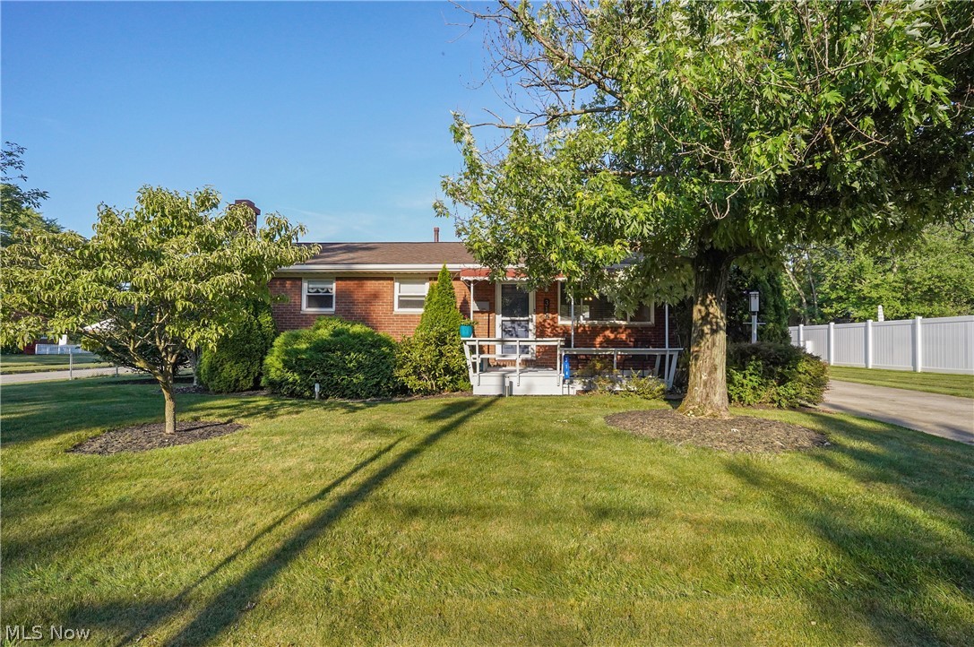 This amazing brick ranch in Munroe Falls has been well maintained. Offering three bedrooms and 2 full baths providing convenience to the owners and guests, spacious living and dining area with hardwood floors, lots of cabinets and counter space in the kitchen (all appliances convey with the sale). There is an option for a first floor laundry in the linen closet (there was once a stackable washer and dryer in this space and it was converted to a linen closet. The plumbing is available should the buyer wish to have laundry on the first floor). One of the stand-out features is the basement as it is super nice with a recreation room/bar area and corner wood burning fireplace - perfect for entertaining and relaxing. There is even a room for an exercise room/office/workshop area or whatever fits your needs, full bath with walk in shower and plenty of storage. The oversized 2 car garage offers nice space for your vehicles and yard supplies. The fenced-in backyard is ideal for outdoor activities, providing a safe and private space for hosting outdoor gatherings. Improvements made within the last year: Hardwood flooring was refinished in the living room and dining room, new electric panel with grounded outlets, updated basement lighting, new light fixtures in the front and back entryways, and ceiling fans added. Freshly painted, and planted arborvitae trees in the back yard, washer and dryer - 2024. Updates: Furnace - 2015, AC - 2017, Roof - approximately 2014