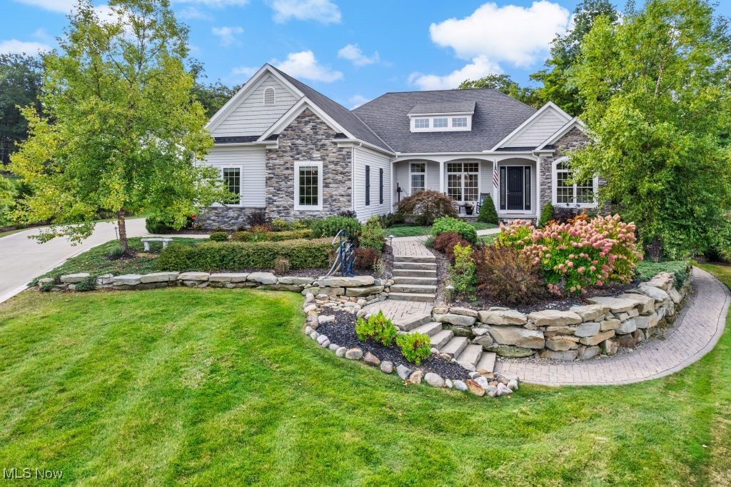 Lake Erie Views & Timeless Craftsmanship-Welcome to your forever sanctuary!
This custom-built 4-bedroom, 4.5-bath Craftsman Ranch sits atop a scenic ridge in one of the area's most prestigious communities. Nestled in a quiet cul-de-sac, the home is surrounded by landscape architecturally designed gardens, private woodlands, and winding paver walkways connecting multiple patios and entrances-creating a seamless indoor-outdoor lifestyle. From the moment you arrive, the charm is undeniable:a meandering front path,lush gardens and a rocking chair front porch with Lake Erie views set the tone for the refined interiors that follow.
Exceptional Quality Interiors
• Grand foyer with soaring ceilings
• Tray-ceiling dining room with Lake Erie views
• Private office with coffered ceilings & custom wall of built-ins
• Vaulted Great Room featuring a stone fireplace flanked by built-ins & dramatic windows
• Rich hickory hardwood floors & 8-foot solid doors
Chef’s Kitchen with breakfast bar island and fabulous morning room-eat in with access to grand covered patio for alfresco dining
• Cambria Quartz countertops
• Stainless steel appliances
• Shaker cabinetry,subway tile&Walk-in Pantry
Luxurious Primary Suite
• Vaulted ceilings, cozy window seat & built-in vanity
• Spa-inspired bath with Marble-topped cabinetry, Jacuzzi tub & tiled shower
• Custom walk-in closet
Versatile Walkout Lower Level
• Spacious family/rec room with kitchenette
• Private guest suite & full bath
• Unfinished daylight space ideal for in-law suite, studio or gym—with separate entrance
Premium Features
• 3-car garage with hot/cold water, drain & gas line
• Generac generator & Wired security system
• Nest thermostat & Central vacuum
• Fresh air ventilation & humidification system
• Tankless water heater & Irrigation system
Prime Location-Minutes from:Little Mountain & Quail Hollow Golf Courses,Holden Arboretum,scenic parks,Top-rated schools, shopping & freeway access