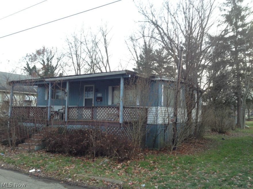 Estate. Sells AS-IS. 2 bedroom / 1 bath manufactured ran on permanent foundation. Taxed as real estate. Eat in kitchen. Bathroom has laundry hookup. Full basement. Large front porch. Detached brick garage (will need a new roof). Home will need a little TLC.