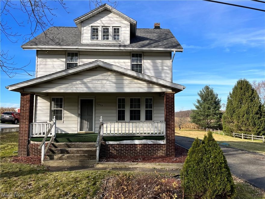 Three Bedroom Home with Garage & Shop on Half Acre - Washington Twp - Marlington LSD. The main level features a large kitchen with updates and stainless steel appliances, a dining room with built-in cabinet and wainscoting, large living room with access to a covered front porch and back deck. Three bedrooms and large full bath upstairs with double vanity. Walk up attic with potential. Full basement with rec room, laundry, and shower bath. Hardwoods under carpet on the main level and bedrooms. Forced air oil furnace, well, and aeration septic. Attached two-car garage with an attached workshop. Rural setting just outside of Alliance.