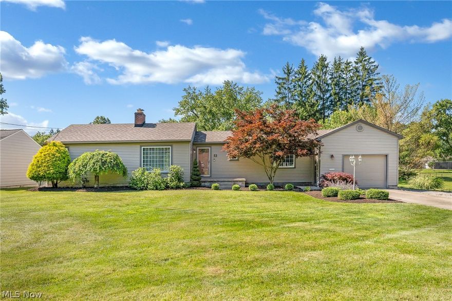 Beautifully landscaped 2 bedroom Ranch style home in Canfield! Entering  the front of the house brings you to a small foyer with coat closet that opens to a large living room with hardwood floors and gas fireplace. Kitchen has  ceramic flooring, stainless steel appliances, and a pantry. Dining room with wet bar and oversized entry doors to the back deck. The main floor also features 2 bedrooms and a full bathroom with linen closet. The master bedroom has his and hers closets and hardwood floors. Full basement with glass block windows,  finished with rec room, possible 3rd bedroom & laundry room, along with Brand new gorgeous 2nd full bathroom with an amazing tiled shower. Awesome backyard with shed and large deck, with concrete patio. Attached garage. Siding 2010  roof 2021/2022, and windows installed 2010. Newer hot water tank. Updated electric and new basement flooring. All of this  plus LOCATION is ideal if your looking to be somewhere where you can walk to the Green to enjoy city activities or only around 15 minutes to Boardman, Austintown, and Columbiana Rt 11 is 2 minutes up the road if looking to commute.