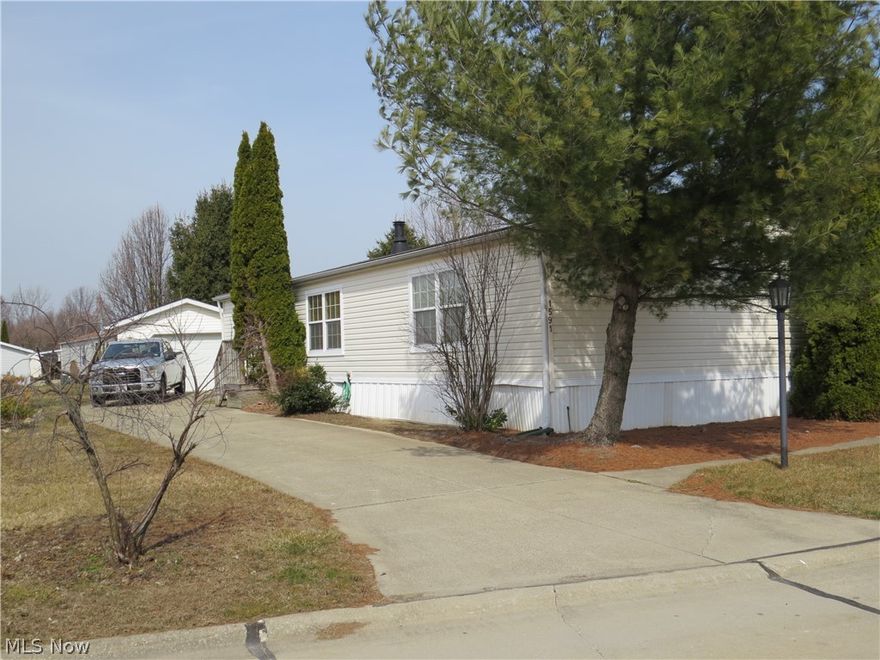 Sectional Home with large 1 car garage and shed! 3 bedrooms and 2 full bathrooms. Large living room with gas fireplace leads to dining room as well as eat-in kitchen that includes island and all kitchen appliances. Master Bedroom with 2 closets and master bathroom with separate garden tub and shower. Split design with 2 bedrooms and 2nd full bathroom on other side of home. Laundry room with washer and dryer included. Skylight over each full bathroom. 12x8 shed. 21x15 detached garage. Home Warranty included! Home is located in a lovely manufactured home park that includes a community center. Quick access to freeway. Make this house your new home today!