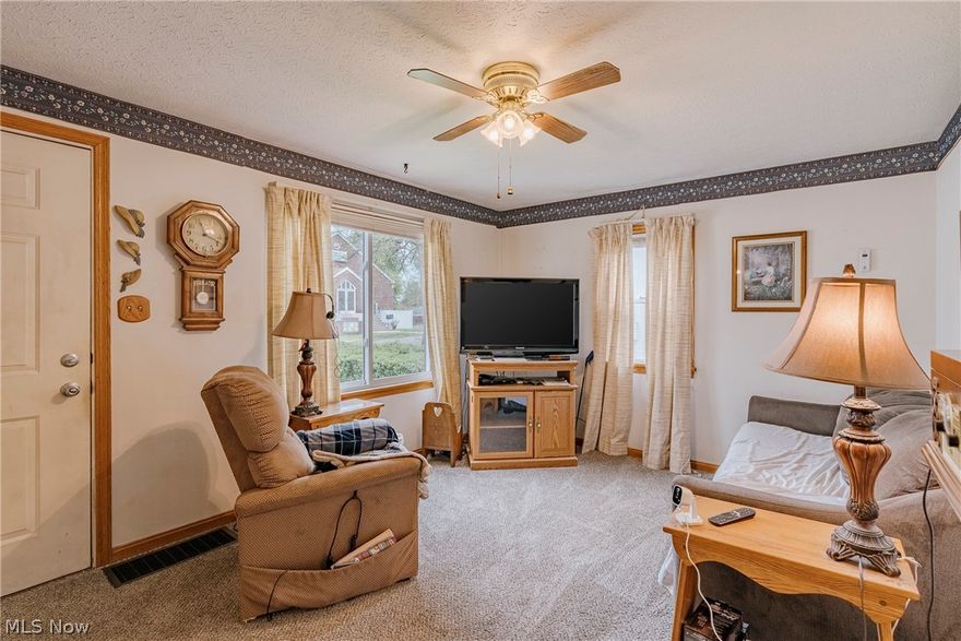 Welcome to 464 Jefferson Avenue in Barberton. Set on a large lot, this ranch-style home offers a functional layout and a standout garage with exceptional versatility. An enclosed front porch provides a warm and inviting entry. Inside, a cozy living room flows into the eat-in kitchen, creating a simple and connected layout for everyday living. From the kitchen, the home extends in two directions. The back of the main level includes two bedrooms and a full bathroom. Just off the kitchen, a short set of steps leads to a bright family room. This space features wood paneling, natural light, and sliding door access to the back porch, adding flexible living and entertaining space. The full basement is unfinished and offers storage, a workshop area, and laundry space. A highlight of the property is the large, heated garage. It accommodates multiple vehicles and includes additional space for storage or workshop use. The fenced-in backyard provides usable outdoor space. It includes a back porch, a storage shed, and direct access to the garage. This home offers a comfortable layout, flexible spaces, and the opportunity to make it your own in a convenient Barberton location!