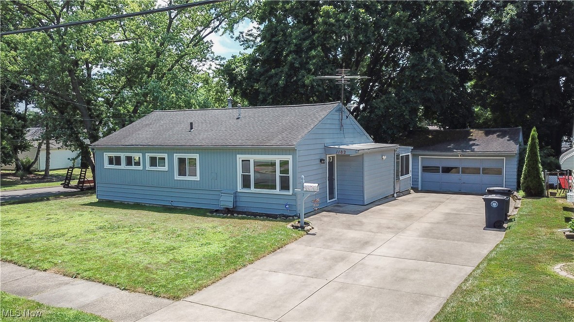 Welcome to this well-maintained 3-bedroom, 1-bath ranch, perfectly situated on a corner lot with a generously sized yard, ideal for outdoor living, gardening, or future landscaping dreams. This home offers easy, single-level living. Step inside to discover new flooring installed in 2018, giving the interior a fresh and modern feel. The bright, airy kitchen is highlighted by a large window that fills the space with natural light, the perfect setting for morning coffee or casual dining. Enjoy extra living space in the attached 3-seasons room, perfect for relaxing, entertaining, or enjoying the outdoors without the hassle of bugs. Outside, you’ll love the detached 2-car garage with plenty of space for storage, hobbies, or a workshop, plus a paved driveway for low-maintenance convenience. This home is the perfect blend of charm, functionality, and outdoor space, don’t miss your chance to make it yours!