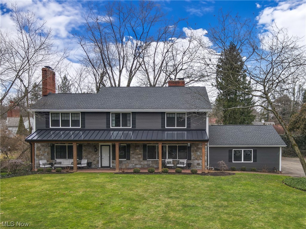 Open the front door and feel the warmth of this home in the natural wood tones of this updated colonial cabin, in pristine condition, with all the upgrades and amenities. Cozy up to the fireplace in the family room, with brick surround and large built ins. Enter the dining room, flooded by natural light and grounded by an impressively sized fireplace. Grab a book by the fire, enjoy an intimate family dinner or host a vibrant party in this gracious space. Into the kitchen is a chef’s delight including deluxe appliances; 6 burner range top, double wall ovens, french door refrigerator. The island is large enough for casual family dinners or large buffet spread of your favorite party foods. With easy access to the back patios this kitchen accommodates great indoor outdoor flow. Lounge outside on the brick laid patios, or throw dinner on the grill and enjoy dining alfresco. In the cool summer nights catch a movie on the couch in the heated covered outdoor den. Theres more to enjoy poolside, where the private lush backyard feels like a retreat on its own. A pop up wet bar adds ease when grabbing snack and drinks outside. Back in the home, a powder room can be accessed easily from outside and mudroom/drop zone lead to the garage. Clad with storage and a nature stone floor, this heated garage is quite a luxury! One the way upstairs there are 4 spacious bedrooms and 3 en-suite bathrooms, all updated to perfection and renovated for best functionality. Note the convenience of the second story laundry! The primary suite is a tranquil space with walk in closet and spa like bathroom. Two separate vanities with sinks offer plenty of storage and counter space. A walk in shower and commode room flank the centerpiece of the bath, a soaker tub and chandelier. More to see in the basement is a finished den; cozy up for a movie or enjoy a seat at the wet bar and watch a game of shuffleboard! A gem of a home that has something for everyone, welcome to 320 ELy.