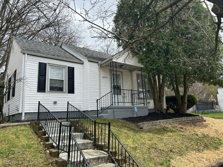 MOVE IN READY oversize two parcel corner lot is ready to call home . So many updates! New kitchen, appliances, bathroom, flooring, lighting, upgraded plumbing, and electrical including panel. Newer roof with vinyl siding. Handicap ramp from garage and back door makes it a breeze unloading groceries. Enjoy cookouts with friends sitting outside under covered patio with nearby fire pit. Great for first time homeowners or seniors looking to downsize to one floor living. Easy to show.