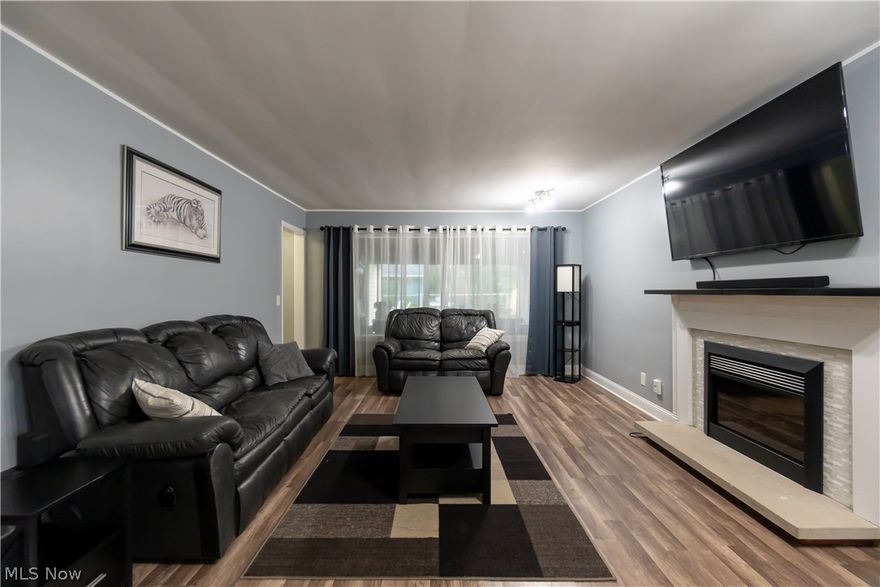 This beautiful mid-century bungalow offers over 1,500 square feet of living space and is conveniently located in one of Berea's many great neighborhoods! With 3 bedrooms, 1.5 baths, and a 14 x 14 three seasons room, it blends modern convenience with classic charm. This home has been thoughtfully and tastefully updated over the years! The backyard provides an ideal area for hosting gatherings and plenty of space for outdoor play. Enjoy the bright and inviting living area complete with an elegant tile fireplace, a large kitchen with center island overlooking the dining area at the front of the house, and the versatile sunroom perfect for summer hangouts or extra storage. From the laundry room, you can access the garage, a stairway to the second level, a half bath, and a side exit to the yard, making it a convenient mudroom as well! The spacious bedrooms and updated baths add to the home's beauty. The second level offers a partially finished space perfect for a dedicated workspace or private sanctuary, with the opportunity to finish it to your liking. Don’t miss your chance to own this perfect combination of character and comfort – it won’t last long!