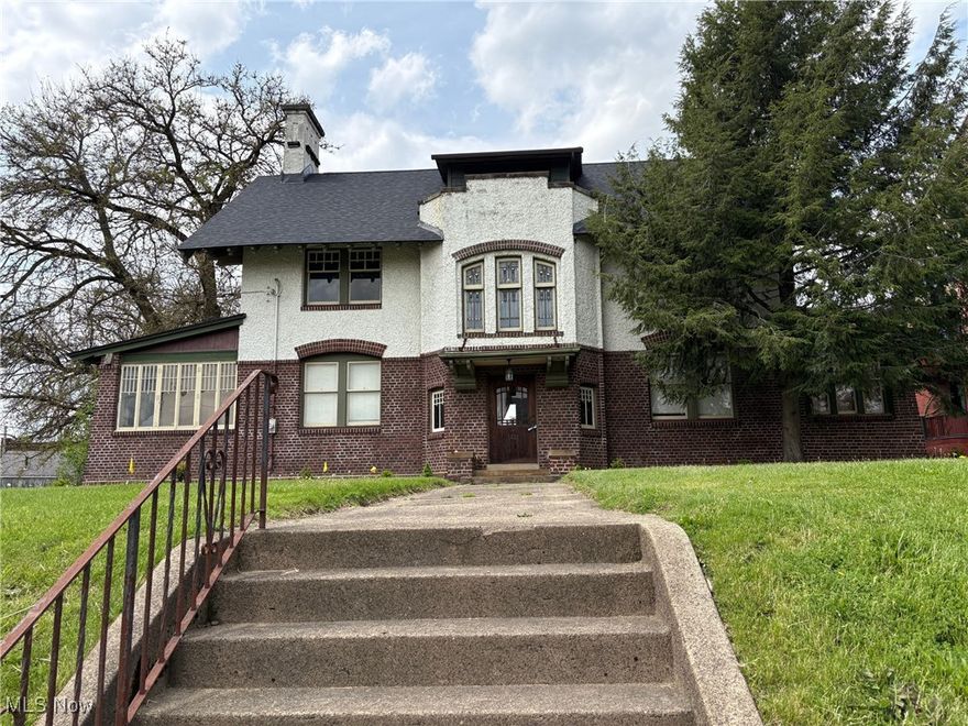 Beautiful Canton Tudor updated to maintain the architectural integrity of the 1900's.  Ideal for a homeowner with a business.  Great location just minutes from Downtown restaurants and businesses, Malone College and quick highway access.  Beautiful craftsmanship and woodwork throughout.  Hardwood and slate flooring. Stained glass window featured above the staircase to the 2nd floor.  3 bedrooms/offices on the 2nd floor with 2 baths.  2 bedrooms/offices and bath on the 3rd floor.  Fenced yard, 4 car garage.  Roof is 2 years old, new furnace + additional furnace for 2nd and 3rd floor heating.  Centra; air is 6 years old.  This is a must-see property to take in all the details.