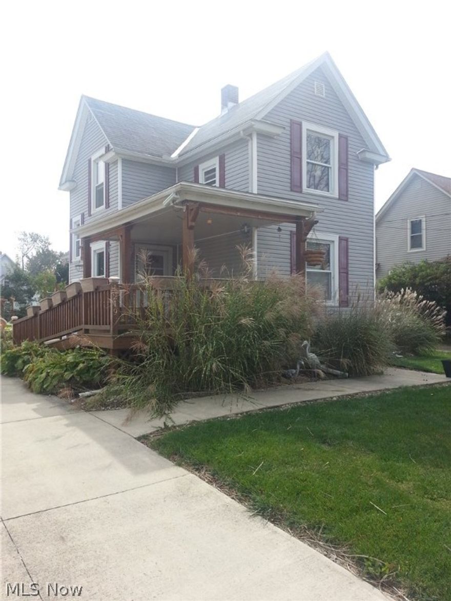 Prop Up Feet Here and Enjoy the View of Lake Erie! Spacious front porch overlooks a manicured lawn of older but wiser two-story homes. This three bedroom Colonial offers handicap accessible front porch, hardwood flooring, updated kitchen with breakfast nook and ceramic back splash, full bath with marble floor, large dining room adjacent to living room area, huge lot, vinyl privacy fence for minimal maintenance, updated windows, ceiling fans, the list of improvements goes on and on! Owner has paid attention to every detail in this home. Seeing is believing! Call today!