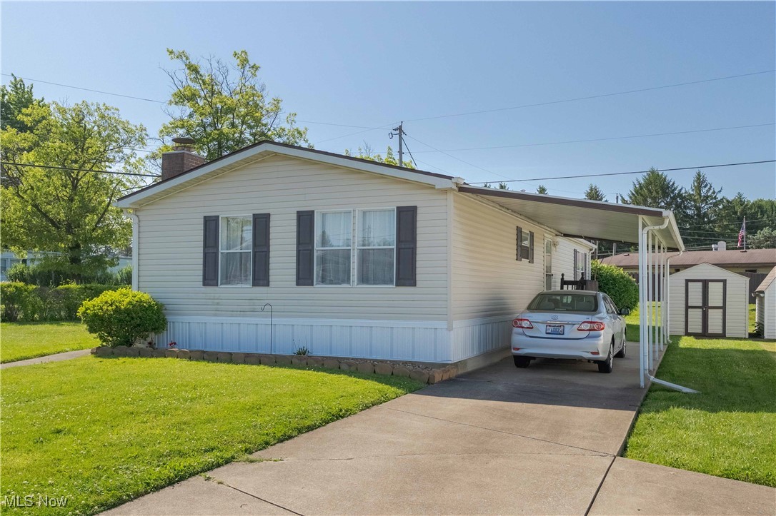 A beautiful, well maintained double wide home in desired Westview Mobile Park. This open floor plan offers large family room with fireplace. Dining room is open to family room for easy entertainment space. Large applianced kitchen with plenty of counter space. The laundry room offers extra storage. You can enjoy morning coffee or relaxing in the evening on the large covered front deck. The landscaping offers privacy and the shed provides extra outdoor storage. Don't worry about the weather as you pull into the carport and access the back door for easy access. Westview is a community that offers a stocked pond for catch and release fishing and a Pavillon for gatherings.