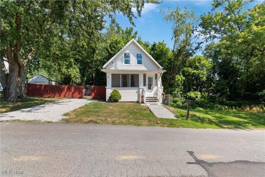 NOW! Look at This...Updated 2BR/1FB Cottage Core Cute! Cape Cod.  Whether you're a first-time homebuyer or an investor looking for a turnkey property, this home is a standout opportunity. NEW Furnace and ductwork 7/25.Recent improvements include a new roof, vinyl siding, and some updated windows. The exterior features a fully fenced side and backyard and a freshly graveled driveway. A welcoming front porch sets the tone for relaxed evenings and casual entertaining.  Light interior with high ceilings and abundant windows creating a bright, airy atmosphere throughout. The home has been freshly painted and has all-new flooring — luxury vinyl plank in the living and dining rooms, vinyl tile in the kitchen and laundry, and new carpeting in both bedrooms, each equipped with ceiling fans for added comfort.The updated kitchen features a new countertop, a stylish tile backsplash, an upgraded sink and faucet, and plenty of cabinet space for all your storage needs. A convenient first-floor laundry area adds practicality to everyday living. Full of cottage charm, this home is truly move-in ready and waiting for its next owner to enjoy.