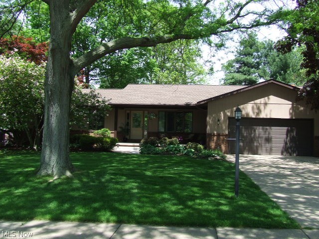 Beautiful 4-bedroom/3-full bath Ranch on rare .6 fenced acre in Tallmadge Highlands. Updated to include removal of two walls to open up floor plan, allowing flow into granite, stainless-steel applianced kitchen w/2 skylights, on into stone/raised hearth fireplaced family room w/sliders to one of the two decks and paver patio. Kitchen has large granite-topped island with seating area. Family rm has built-in shelves and granite "buffet/serving" area. Living rm is currently set up as huge dining rm and dining rm set up as living/sitting rm, openness gives many possibilities. Sitting rm has sliders to other deck as does master bedrm. Master bedrm has walk-in closet, "other" area that incl vanity space & master bath. First floor laundry w/cabinets, counters, utility sink & mud room/side entrance & attached 2-car gar. Lower level incl 4th bedrm & 3rd full bath along w/large rec rm, plenty of storage area & crawl space for even more storage. $50,000 worth of updates in last 3 years pl