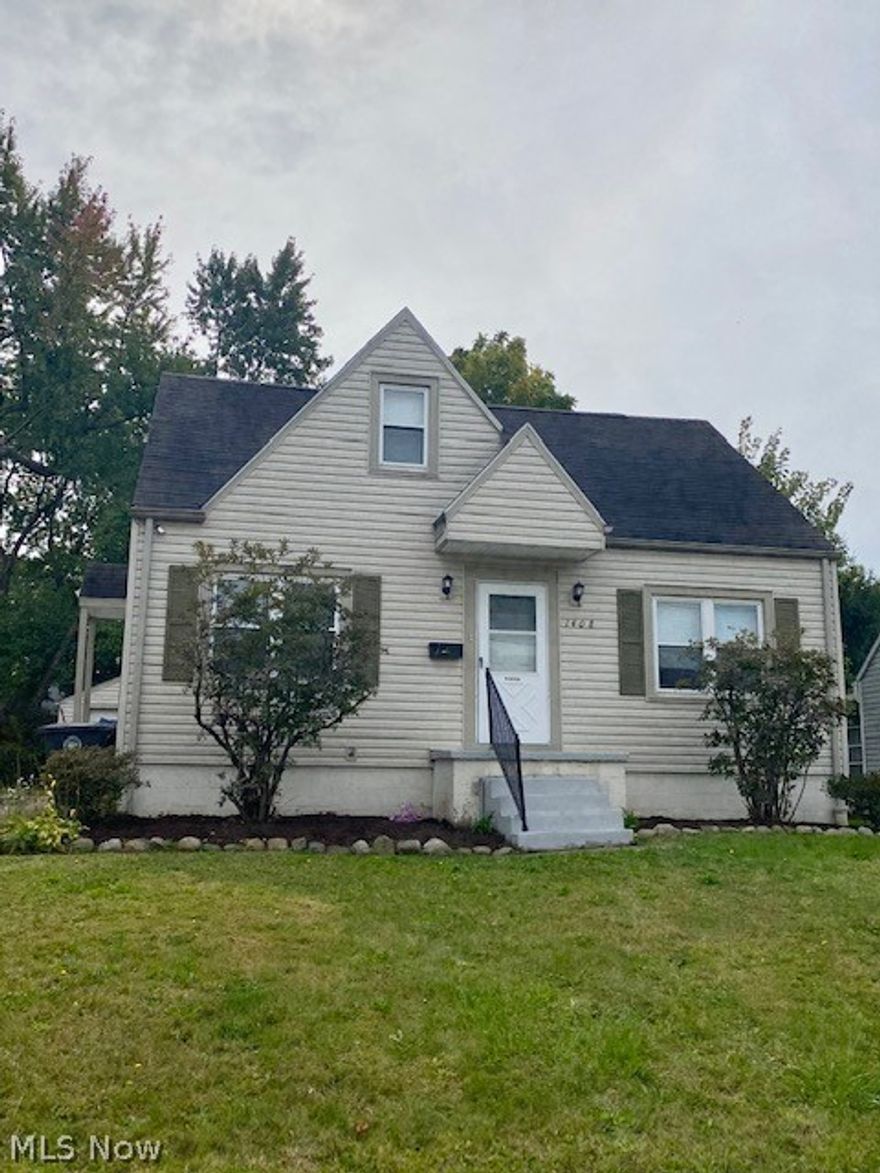 You won't find a better value in Goodyear Heights then this beauty right here!  If updated, bright decor and move-in ready are on your list, then you've found your next home!  Nice sized living room flows into eat in kitchen w/plenty of space for a small table for two, freshly painted and new flooring!  The kitchen has a nice back door that was added in 2014 so you can easily access the completely fenced in (2014) backyard, perfect to let your furry friends out to play year round!  There are two good sized bedrooms and a completely updated (2018) full bath.  Upstairs is a HUGE master bedroom with plenty of closet space!  The basement is AMAZING, it features a large recreational room, a smaller space that could be another dining area OR home office-since it's tucked away in the corner.  There's a second, updated, full bathroom; laundry area and plenty of storage still in the basement!  One car detached garage, too!  A/C was replaced August, 2022, furnace was serviced in July 2022.  HURR