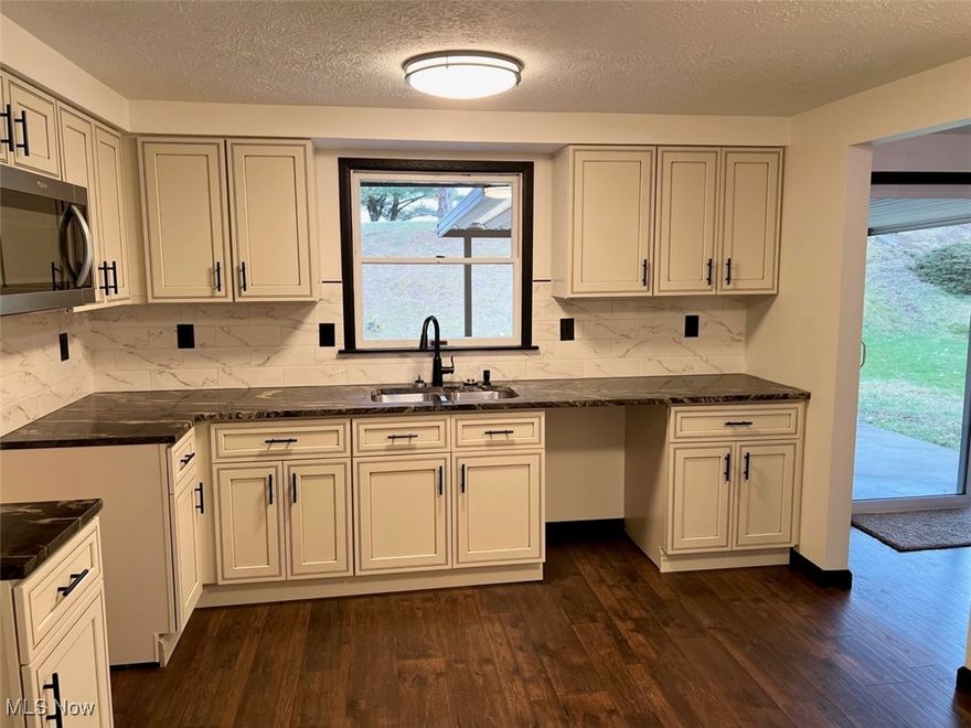 Completely remodeled 2044 square foot home with 2,744 total finished area home in the Country Club Subdivision. 5 total bedrooms all on the main floor and 3 full baths all remodeled with new flooring and cabinets with granite countertops. Master bath is equipped with a double vanity, walk in shower, and large jetted soaking tub. Kitchen upgraded with brand new cabinets and granite countertops.