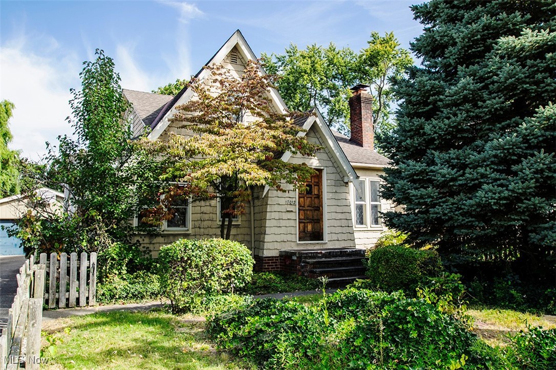 You'll find exceptional value in this West Park diamond in the rough teeming with all the charm and character of yesteryear! Situated on a generous lot and desired street this roomy shake cedar sided master bungalow boasts offers 2,000 sq ft of living comfort. Convenient vestibule entry opens to a sizable living room with wood burning fireplace and a beamed ceiling highlight. Formal dining room also features a beamed ceiling. The roomy kitchen is an open design and joins a morning room with bay windows flooding the space with natural light. Full bath with retro tile walls and flooring and 2 bedrooms with generous closets completes the floor. Upstairs you will discover a 3rd bedroom, full bath and a versatile bonus room. The full basement with a partial bath brings ample storage and a separate laundry area. So much potential here!