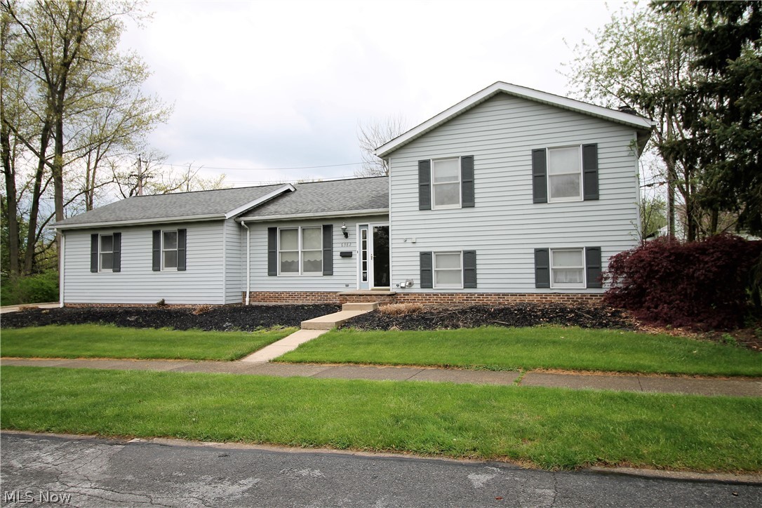 Welcome to this charming split level three bedrooms, two full bath home. Come on into the first floor which has new flooring and natural, versatile colors throughout. The large great room offers so much natural light through the large window and is open to the eat in kitchen. The kitchen has abundance of cabinets and plenty of counter space, the stove, dishwasher and range hood all new (2012). The eat in kitchen area has a slider which has built in blinds and goes out to the stained deck (2020) which offers more sunlight coming in. The upper level has three bedrooms which all have new flooring and full bath. The full bathroom has new toilet and faucet. The lower level has gas fireplace with blower, full bathroom, laundry room and so much more room for entertaining, 4th bedroom etc. There is a huge side yard for your outside entertaining needs. Two car attached garage. Some updates include roof (2011), tankless HWT, furnace/AC (2012). This home is where is your precious memories begin!
