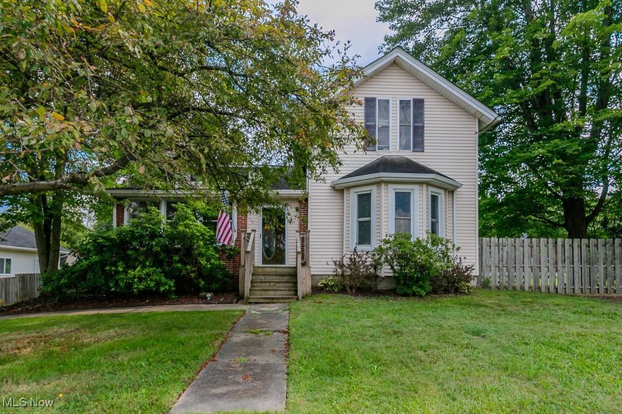 Just minutes from the Geauga County line, this immaculate Colonial is full of charm and boasts irresistible curb appeal! Nestled on nearly an acre, there's plenty of space to create your ideal outdoor lifestyle. The oversized 30x20 garage is a dream for any mechanic or hobbyist, offering ample room for two vehicles and still leaving space for tools, toys or a small workshop. Need more storage? A clean and tidy shed in the backyard is ready for your extras. Both the front and back of the home feature large enclosed porches, perfect for relaxing. Inside the formal dining room serves as the heart of the home, with plenty of room to gather friends and family.  The bright, sunny kitchen has been completely updated with modern finishes, including elegant patterned tile backsplash, granite countertops, cabinetry and newer LVP flooring. Cooks will love the generous counter space, the window over the sink with a view of the backyard and a convenient door with access directly to the yard, perfect for outdoor grilling. The spacious living room is filled with high ceilings and natural light, creating a welcoming atmosphere. Upstairs, the large master bedroom offers great closet space, while a versatile loft area at the top of the stairs could serve as a cozy reading nook, nursery or additional bedroom (it even has a closet!). The basement is clean for the age of the home, features updated plumbing, and upgraded electrical panel and newer water system. Laundry hookups are also down there for your convenience.