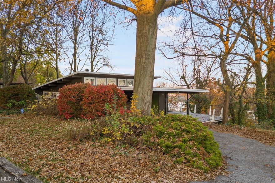 'Twas a house in Akron, with views so divine,
Mid-century charm, it would brightly shine,
Overlooking Summit Lake, and the city lights bright,
A home that would fill every heart with delight.

The kitchen was gleaming, with appliances rare,
The dining room echoed, with laughter in the air,
Great Room was cozy, with a fireplace warm,
Windows framed beautiful views, in a picturesque form.

On the first floor, a bedroom so neat,
Could be an office, a bonus room, such a comfy retreat,
The staircase was crafted, with stones so grand,
Leading to bedrooms, in a lower level land.

A carport stood sturdy, for vehicles two,
Back deck provided a scenic view,
With a roof that was fresh, and paint so bright,
This home was a gem, in the soft evening light.

With Summit Lake near, and Akron's cheer,
This house was a dream, it was perfectly clear,
A home filled with joy, in every nook and crevice,
Bringing warmth and love, a true slice of bliss.