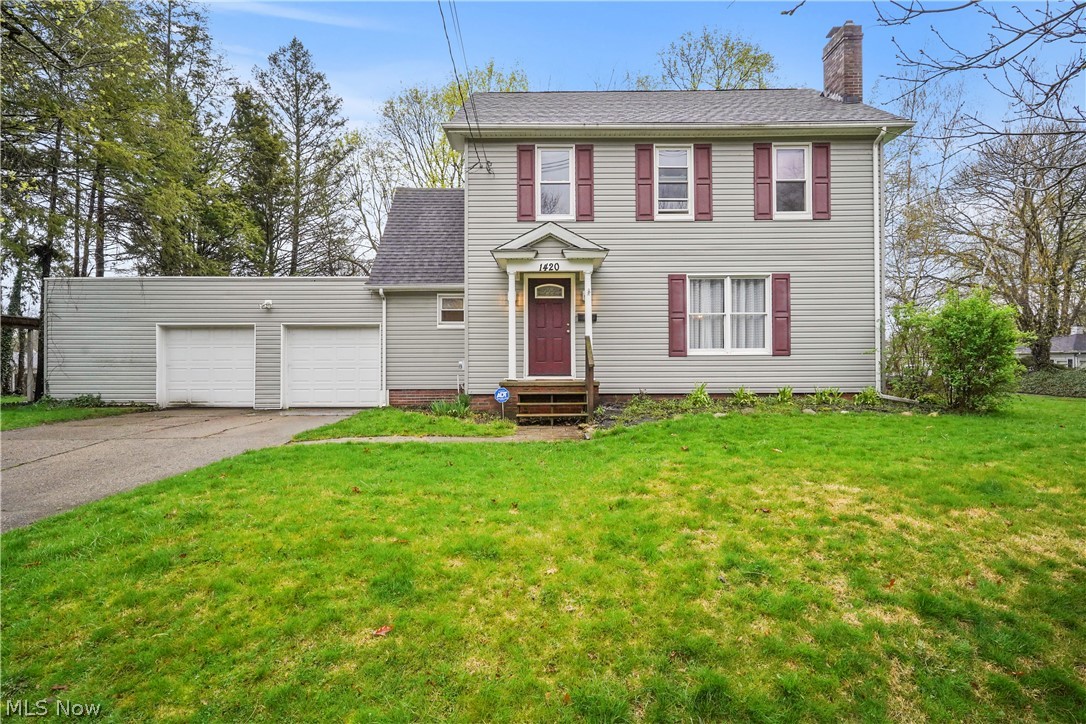 Picture a colonial-style home full of charm and character! The spacious living room offers a woodburning fireplace with beautiful wood trim and brand new carpeting. The dining room is also good size. The kitchen is bright and includes all the appliances. There's even a quaint, cozy reading nook or breakfast room that exudes warmth and comfort with lots of windows allowing for an abundance of light. Enter the 3 season sunroom, which leads to the deck that extends the living space outdoors - perfect to enjoy grilling, entertaining and basking in the sunshine. A drop zone/mud room area off the attached 2+ car garage and powder room complete the first floor. The second floor features 3 bedrooms, office/bonus room and full bath and there's even a 4th bedroom on the third floor. The basement is partially finished and offers a 2nd fireplace. Lots of storage in the basement with built ins and a separate room. Bonus - there is a huge room off the 2 car garage that could be a perfect workshop or more storage.