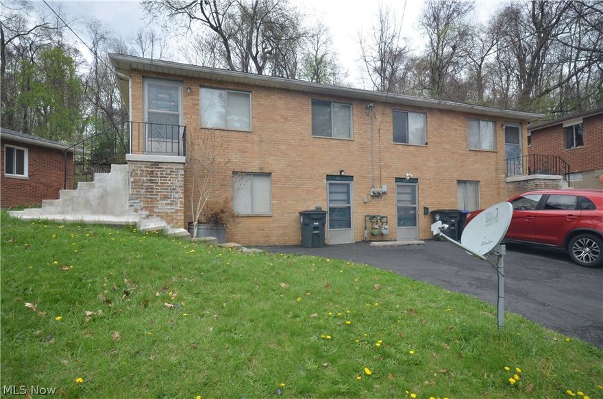 Brick 2 unit on a low traffic street near a dead end- Ellet Schools (Betty Jane, Hyre, Ellet) with one unit vacant and the other unit occupied with a long term (13 year) tenant! Each side offers 2 bedrooms, 1 full bath, good hallways closet storage and eat in kitchen with range and refrigerator owned by the landlord and will transfer to the buyers. the front living room is a nice size and there is a rear door near the kitchen that leads to the patio / back yard. Each unit has a private full basement with laundry hookup and direct access from the front. Each unit has one parking spot on the recently updated blacktop driveway- plus there is plenty of on street parking available. Tenants pay gas, electric, and mow/remove snow on their side of the building. the furnace in 280 was updated in roughly 2013 and hot water tank in 2023. In 282 the Furnace was replaced Feb 2013 and Hot Water Tank May of 2021. Owner pays Akron water/sewer/trash which ranged roughly $165-175/ month total in 2025. There is one meter for the water/sewer trash for the building.Tenant at 282 (right side) has occupied the property since February 2013- so rent is low for the long term tenant. Current rent is $660 with a 10% discount for payment received on or before the due date. The leftt hand unit will be available for showings- the right hand unit will only be available for second showings as a courtesy to the tenants. Property is being sold AS IS- sellers are looking for a smooth transaction and will not make any repairs/negotiations post closing.