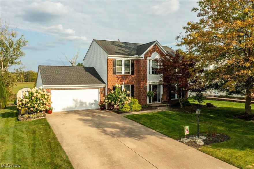 This charming colonial offers 3 spacious BDR & 2.5 BA, provides township living without city income tax! You’ll be welcomed into the home with a 2-story foyer and engineered hardwood flooring that leads seamlessly into the dining room, and creates an elegant atmosphere for family gatherings. If you need a dedicated workspace, you’ll appreciate the 1st-floor office, strategically located to provide a quiet environment away from distractions of the household. The heart of this home is the open concept kitchen and family room. The kitchen features elegant granite countertops, a gas stove, and stainless steel appliances, making meal prep a breeze. In the family room, a cozy gas fireplace awaits, complete with remote control blinds for added convenience. The owner’s bedroom with an updated en-suite bath and a roomy walk-in closet, offers the perfect sanctuary at the end of the day. Two other bedrooms share an updated bathroom, featuring new LVP flooring, lighting, and vanities. Additional flexible living space in the partially finished basement spans 400 sq feet.  Major updates in 2021 include a new furnace, A/C, H2O tank, and windows. A new Pella front door and patio sliders enhance both curb appeal and functionality. Step outside to discover a backyard oasis, beautifully landscaped with three patios, including a fire pit and a hot tub area. The backyard borders a 2-mile walking trail that encircles the development, providing a picturesque backdrop for outdoor relaxation.