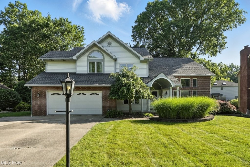 Welcome home to this beautifully updated colonial in the highly sought-after Hunters Crossing community of Stow! Featuring 4 bedrooms, 2.5 baths, with over 2,559 sq ft plus a finished basement, this spacious property offers the perfect blend of comfort, functionality, and modern style. Step inside off the front porch to a vaulted-ceiling entry and adjacent living room, filled with natural light flowing seamlessly into the dining room, perfect for gatherings and special occasions. The open-concept eat-in kitchen, with newer appliances and granite countertops, connects to a family room with continued high-ceilings and gas fireplace, creating the heart of the home. With sliding glass doors to the large back deck overlooking the fenced-in yard, this space is perfect for entertaining, or simply relaxing indoors or outdoors. The first floor also features a private office, laundry room, and half bath for added convenience. The second level, with a balcony partially overlooking the first floor, features an impressive primary suite with vaulted ceilings, new carpet/paint and a fresh design, a walk-in closet, and a spacious en suite bath. Three more spacious bedrooms and full bathroom with a shower/tub combo are also on this level. There is a finished basement, still with plenty of storage space, offering a ton of additional living and recreational space, perfect for a media room, playroom, home gym or whatever your needs! A two-car garage with an extra wide driveway gives ample room for parking for yourself and guests. Other recent updates include: furnace 2018, AC 2020, water tank 2019. Located in a desirable neighborhood close to shopping, dining, and highway access, this home offers the space you need with the lifestyle you’ve been looking for, schedule your showing today!