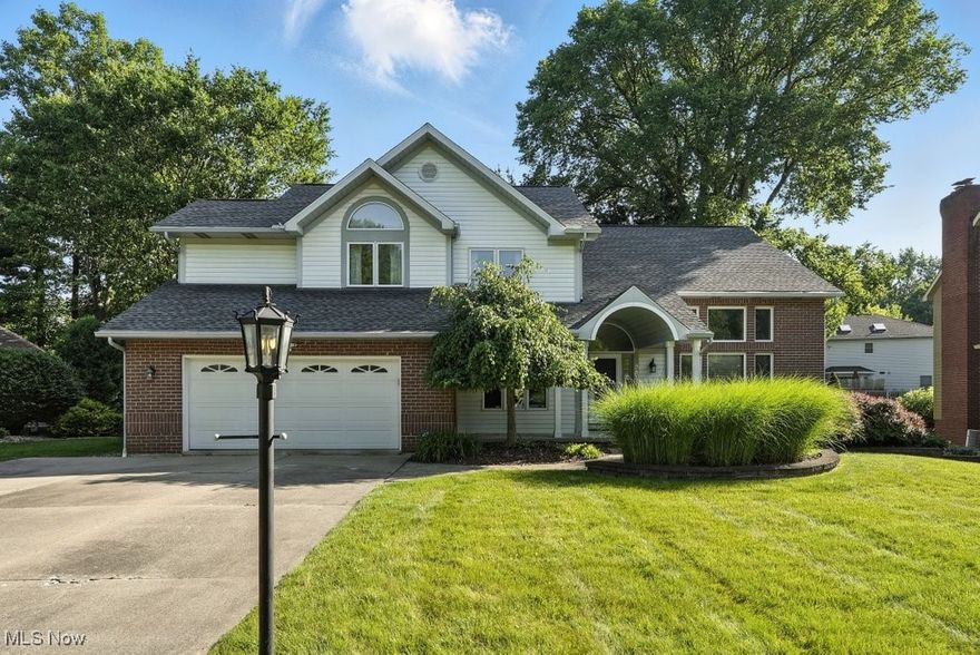 Welcome home to this beautifully updated colonial in the highly sought-after Hunters Crossing community of Stow! Featuring 4 bedrooms, 2.5 baths, with over 2,559 sq ft plus a finished basement, this spacious property offers the perfect blend of comfort, functionality, and modern style.  Step inside off the front porch to a vaulted-ceiling entry and adjacent living room, filled with natural light flowing seamlessly into the dining room, perfect for gatherings and special occasions. The open-concept eat-in kitchen, with newer appliances and granite countertops, connects to a family room with continued high-ceilings and gas fireplace, creating the heart of the home. With sliding glass doors to the large back deck overlooking the fenced-in yard, this space is perfect for entertaining, or simply relaxing indoors or outdoors.  The first floor also features a private office, laundry room, and half bath for added convenience.  The second level, with a balcony partially overlooking the first floor, features an impressive primary suite with vaulted ceilings, new carpet/paint and a fresh design, a walk-in closet, and a spacious en suite bath.  Three more spacious bedrooms and full bathroom with a shower/tub combo are also on this level.  There is a finished basement, still with plenty of storage space, offering a ton of additional living and recreational space, perfect for a media room, playroom, home gym or whatever your needs!  A two-car garage with an extra wide driveway gives ample room for parking for yourself and guests.  Other recent updates include: furnace 2018, AC 2020, water tank 2019. Located in a desirable neighborhood close to shopping, dining, and highway access, this home offers the space you need with the lifestyle you’ve been looking for, schedule your showing today!
