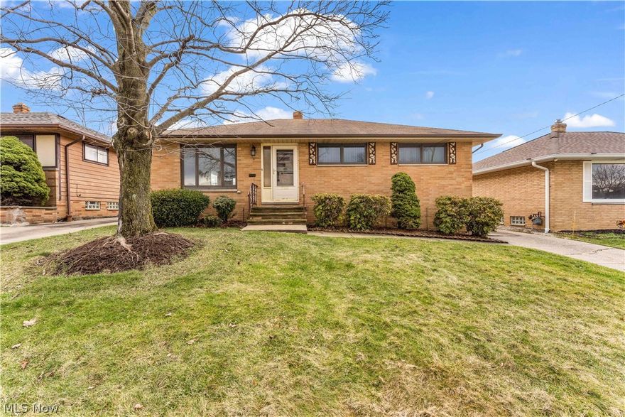 Welcome to 15312 Rowena Avenue in wonderful Maple Heights! This 3 bed/1.5 bath brick ranch sits on a quiet street and is the epitome of one floor living. The home features spacious living areas with hardwood floors throughout the living room, dining area, and all 3 bedrooms. The kitchen offers new flooring, new countertops, and freshly updated cabinetry. Both bathrooms are located on the first floor for your convenience. The partially finished basement includes another office/bedroom area. The finished section features carpet flooring along with a classic "basement bar" and a utility room section with a newer hot water tank. The backyard features a wonderful patio with access from the dining room, a brick 2 car garage, and plenty of green space. Ready for its new owner...schedule your showing today!