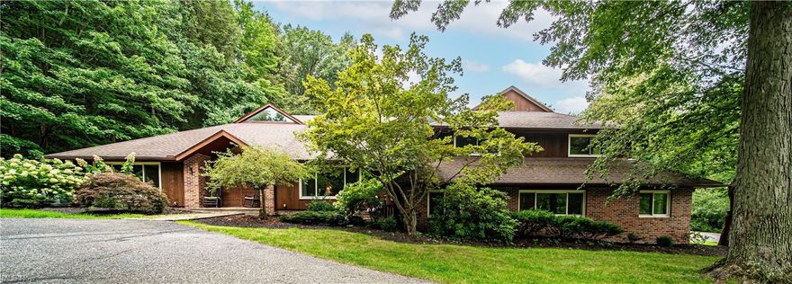 Welcome home to this beautiful & sprawling 5 bedroom 6 bath estate on 3.2 acres. 
This high-quality, custom-built home offers superior craftsmanship.  Be wowed as you enter through the double doors into the grand foyer.  The great room features vaulted ceilings, full bar with copper countertops, a step down sitting area with wood burning fireplace adorned with beautiful natural stone.  Dining room, living room, with tons of natural light, a large family room, and a beautifully renovated kitchen that boasts an island, breakfast bar, and an eat-in area for dining. Off of the kitchen is a spacious three season room. The master suite is enormous with two separate master bath areas; both have their own sink, and two large closets.  The upstairs features 3 more bedrooms and two additional full bathrooms. Retreating a few steps down to the lower level is a large family room with a dedicated workout area and slider leading to one of the patios, a 1/2 bath, media room, and lots of storage.  Also on the lower level (which is above grade) is the 5th bedroom with an attached full bath and a beautiful office.  Spacious laundry room, an art/craft room (or second office).  This home also boasts a three-car garage with new doors and seal fleck floors.  Home was converted to gas and has two new HVAC systems in 2019, all new windows and sliders throughout.  A true gem and one of a kind home! The property includes a huge playground, two sitting decks, two patios, and an inground pool.
