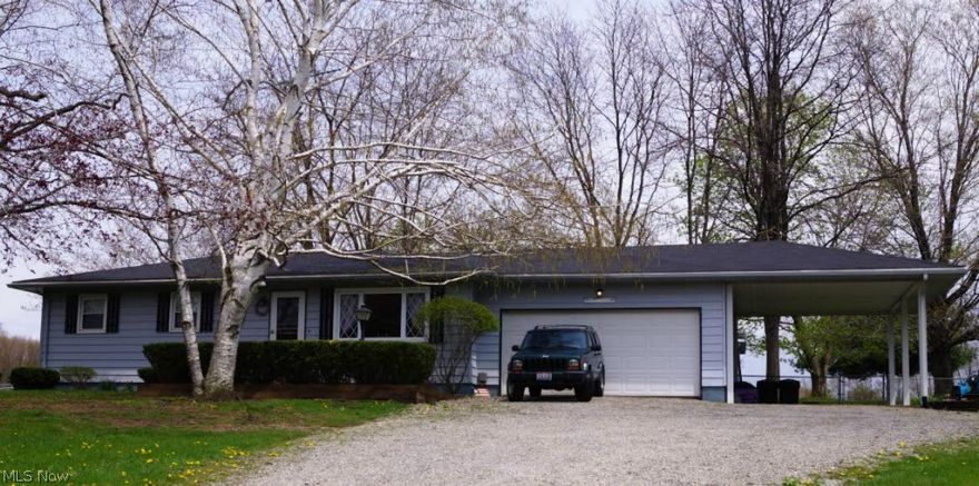 Be the proud new owners of this beautiful ranch home.  Located just on the outskirts of town on 1.23 acres offers you the feel of country living with the convenience of shopping, banking, schools, and churches only one mile away!  Spacious family room with office/library in the lower level.  2 car attached garage w/carport.  Fenced in large back yard.  Large deck and outbuilding, cute....quaint...and affordable!