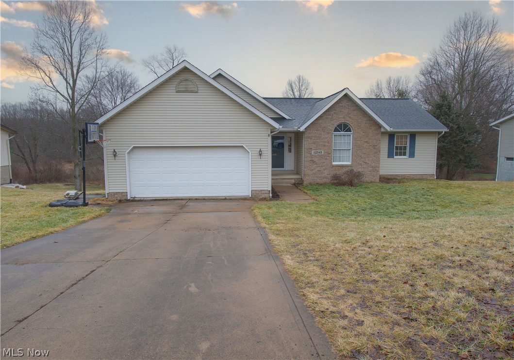 Welcome to this ranch-style home located in Lawrence twp-Northwest City School. This lovely home features an open floor plan, three-bedroom, two-bath, with over 2,000 sq ft of living space. The welcoming great room has a vaulted ceiling and a gas fireplace. The eat-in kitchen offers plenty of counter/cabinet space and abundant natural light from the dinette area, with patio doors leading to the deck. The master bedroom has a private bath with a skylight and a walk-in closet (7x5). Easy living with a convenient First-floor laundry. The partially finished walk-out basement has a Recreation room, a bonus room that could be used as a playroom or office, and ample storage space. This house has a new roof and an attached 2-car garage—professionally cleaned, with newer carpet and paint. Make an appointment for your private showing today!