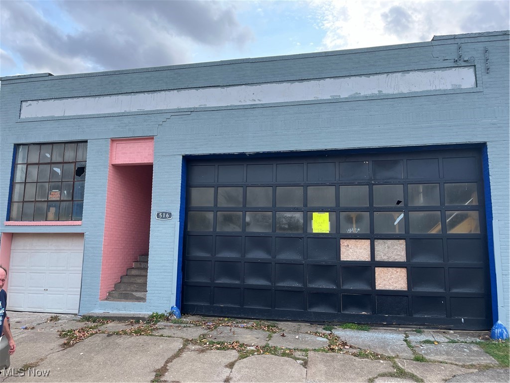 516 West 48th Has 15 foot ceilings, The 20 foot garage door is on the front, The basement run's the length of the building, Seller will meet buyer or His agent . Contact agent for more information.