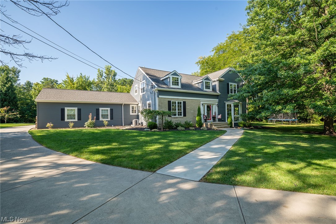 This completely remodeled 4 bedroom, 3½ bath home is nestled in the lovely city of Strongsville. In 2020 this home was renovated down to the studs. Lush landscaping & robust trees line the sides & back yard, enhancing this beauty & overlooks an outdoor haven where peace & tranquility can be found! The entry opens to the foyer w/ hardwoods that leads to the family room featuring a fireplace, built-in shelves & access to the 4 seasons sunroom while gazing at the picturesque outdoor living space. The bright & inviting kitchen will inspire you to cook, while the center island w/ a breakfast bar provides the perfect spot for those informal meals. Stainless steel appliances, granite countertops, backsplash, ample cabinetry, & a cozy wood burning fireplace completes the kitchen. A formal dining room & laundry room w/ custom storage options that can suit both coats, bookbags and shoes. Convenient 1st floor bedroom & a luxurious 1st floor bath w/ a stand up shower & a spacious vanity w/ granite