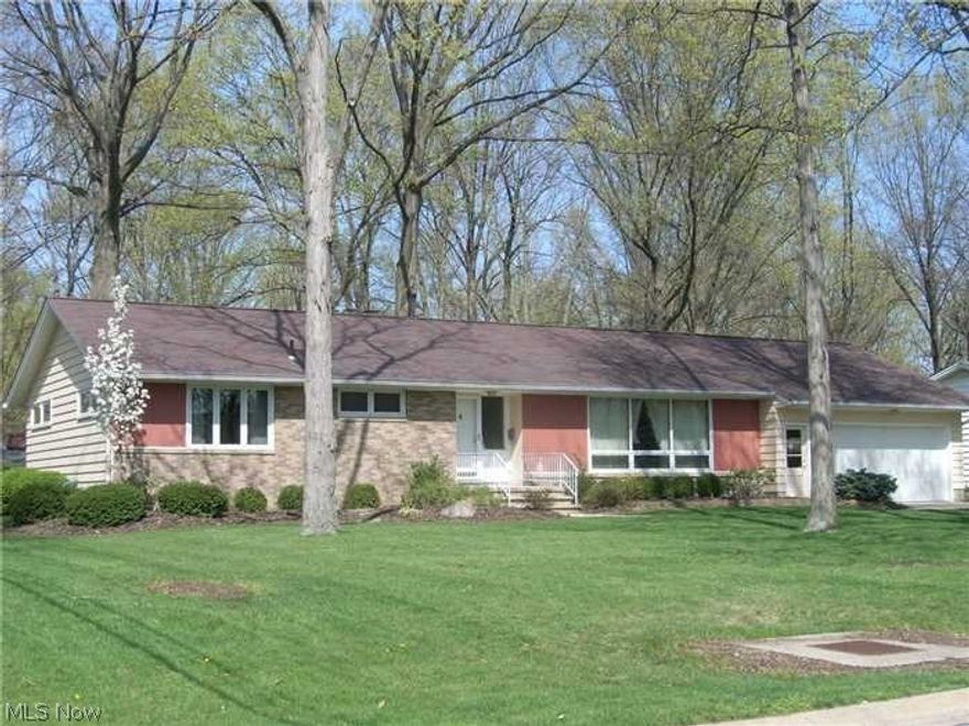 Welcome home to ranch style living in one of Amherst's finest locations.  Serene treed lot just under 1/2 an acre.  Attractive, upgraded kitchen, family room with wood burning fireplace and sliding glass doors to the enclosed three season room overlooking the lovely back yard.  Living room large enough to also have a dining table.  Hardwood floors under carpeted rooms except the family room and kitchen.  You will enjoy the extra rooms in the basement that also features a kitchen, loads of storage and a bath.  Over-sized attached garage with attic for additional storage.  This is a Burt Witte built home!