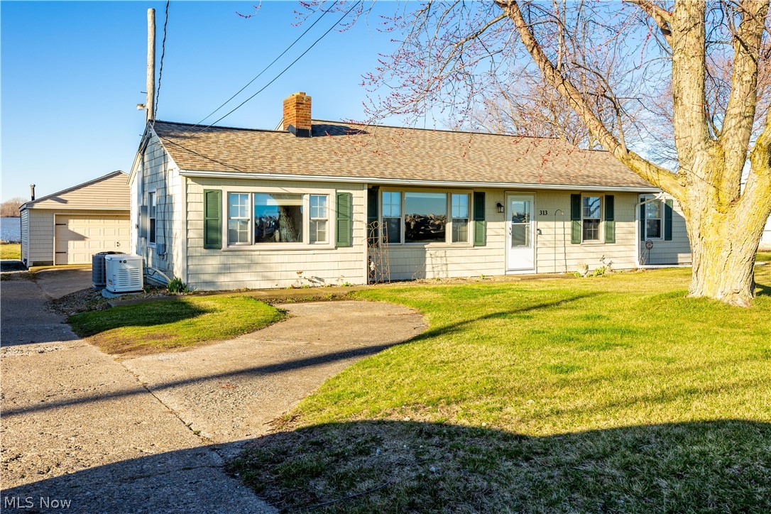 Location Location Location! This is an amazing move in ready updated waterfront ranch home uniquely surrounded by the Sandusky Bay & Lake Erie. Look no further this 1888 sq ft home w/3 beds & 2-1/2 baths has everything you need for lake front living. Perfect for family, vacationing, entertaining, fishing & much more. New Furnace/AC/Generator/Gutters/New Electrical/Mini Split added to family room/30 amp RV outlet in Garage/updates in screen porch overlooking the bay, one of the only homes up front that has a walkway down to the lake. Close to shopping, entertainment,dining & Cedar Point. Make your appointment today.