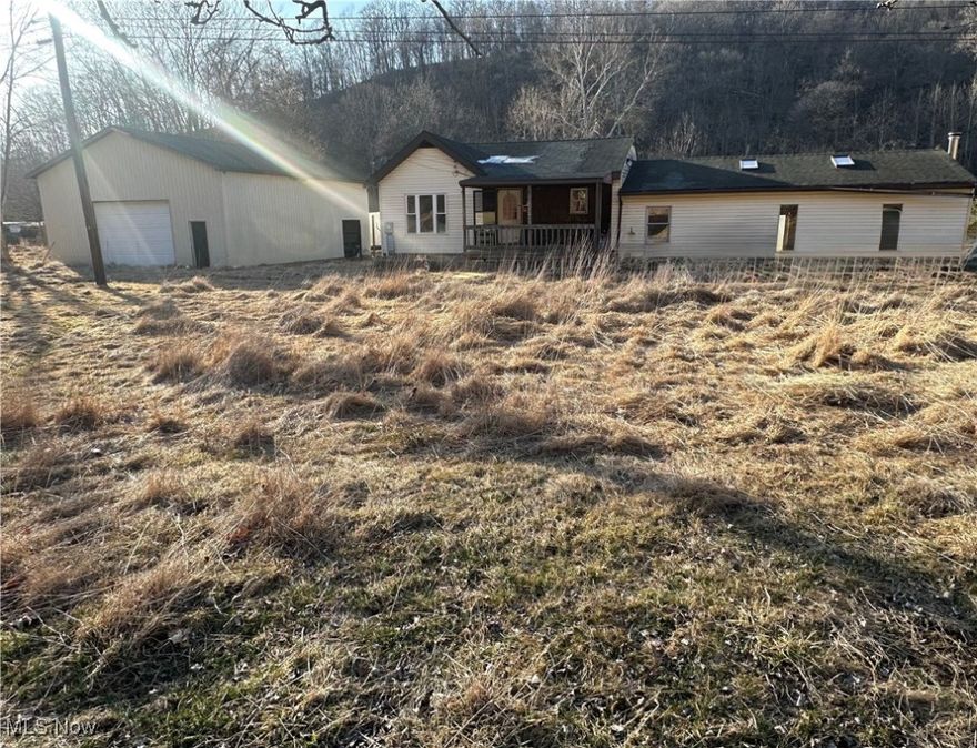 Calling all Investors and home buyers who have vision!! This home is situated on 2.75 acre lot of flat land the includes a 1400 sq. ft barn and a second 2 story workshop that has a separate electric service and a 2 car garage . The Home features a Large eat in kitchen with oak cabinetry and hard wood floors. The expansive family room with a freestanding fireplace and double French door gives you plenty of room for entertainment and family gatherings alike. This home is an ideal choice for homeowners seeking space and tranquility on a budget. Book a showing today!!