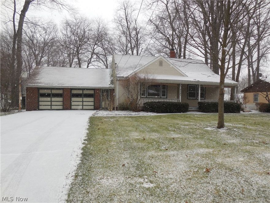 Looking for a home in Canfield Schools? Gorgeous setting, with Beautiful 2 LOTS with this sale - 75x237 lot and a 50x200 lot equaling a total of .638 of an acre that is mature and relaxing and gives you room to spread out! This three bedroom Cape Cod home has a two car attached garage! The spacious living room has great natural lighting, custom wood blinds and wood ceiling! The kitchen has plenty of cabinets and counterspace along with dishwasher, stove and microwave to stay! Large dinette gives you plenty of space for meals. The full bath is on the first floor and has a tub shower combination. The first floor master has great space and has 2 closets plus a beautiful ceiling. Bedroom two has hardwood floors and is roomy. The third bedroom is huge and is hardwood floored with lots of closet space including a walk in! This is an awesome space upstairs! The basement is finished into a big family room with gas fireplace and a bar! Two workshop areas, a nice laundry space and there is a sta