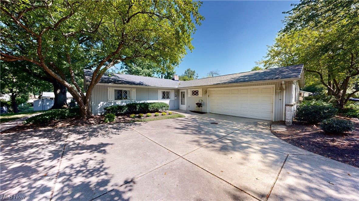 One-floor living at its finest! Enjoy comfortable, easy living in one of the most desirable locations of Lyndhurst! This charming ranch style home boasts an open and airy ambiance with loft ceilings and tons of natural light! The spacious kitchen offers plenty of cabinet and countertop space, comes equipped with all appliances including a built-in double oven, a peninsula with cooktop and room for high top seating! The extensive living room that opens to the dining room is the perfect space for entertaining and features a fireplace with stone surround! There's certainly no shortage of living space here as this spectacular home offers an additional cozy and inviting family room living. This family room leads out to your wooded backyard with private deck. Stroll down the bedroom hallway and you'll find the master bedroom with ensuite, two sizable bedrooms and full bath. Two car attached garage, large mud room area and conveniently placed laundry room. Just minutes from freeways, Beachwoo