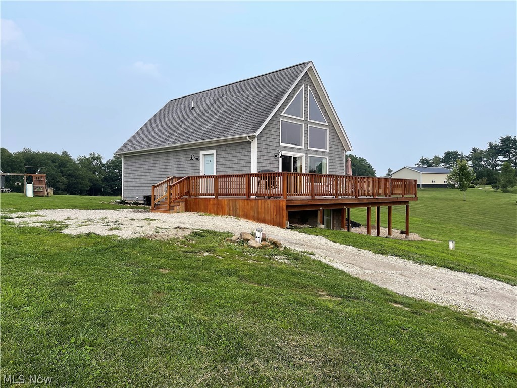 Postcard Setting! Sitting on 2.78 acres of tranquil setting is this three bedroom, two full bath home. Come on down the long driveway and into the open living room offering wall of windows to let the natural sunshine through making it bright and cheerful, new sliding door (2017) that opens to the large fabulous wraparound deck (2020) so you can sit out and enjoy the picture perfect views, dining room and kitchen. The neutral, beautiful updated kitchen has granite counters, breakfast bar, abundance of cabinets, refrigerator, dishwasher, oven and all open to the living room, dining area which is great for entertaining. Continuing on the main level there are two large bedrooms offering new floor (2017), electric heat pump, backup baseboard, and a full bright bathroom offering modern lighting, shower, toilet, and sink. As you go upstairs there is a spindle stair rail to a large master suite with a full bathroom offering a shower, sink, and toilet. The partially finished lower level (2020)