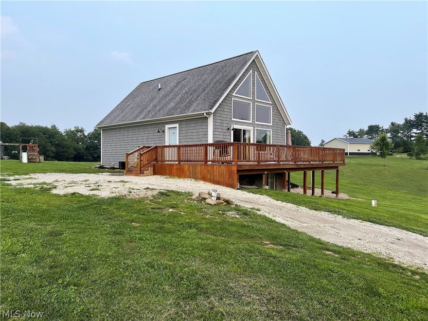 Postcard Setting! Sitting on 2.78 acres of tranquil setting is this three bedroom, two full bath home. Come on down the long driveway and into the open living room offering wall of windows to let the natural sunshine through making it bright and cheerful, new sliding door (2017) that opens to the large fabulous wraparound deck (2020) so you can sit out and enjoy the picture perfect views, dining room and kitchen. The neutral, beautiful updated kitchen has granite counters, breakfast bar, abundance of cabinets, refrigerator, dishwasher, oven and all open to the living room, dining area which is great for entertaining. Continuing on the main level there are two large bedrooms offering new floor (2017), electric heat pump, backup baseboard, and a full bright bathroom offering modern lighting, shower, toilet, and sink. As you go upstairs there is a spindle stair rail to a large master suite with a full bathroom offering a shower, sink, and toilet. The partially finished lower level (2020)