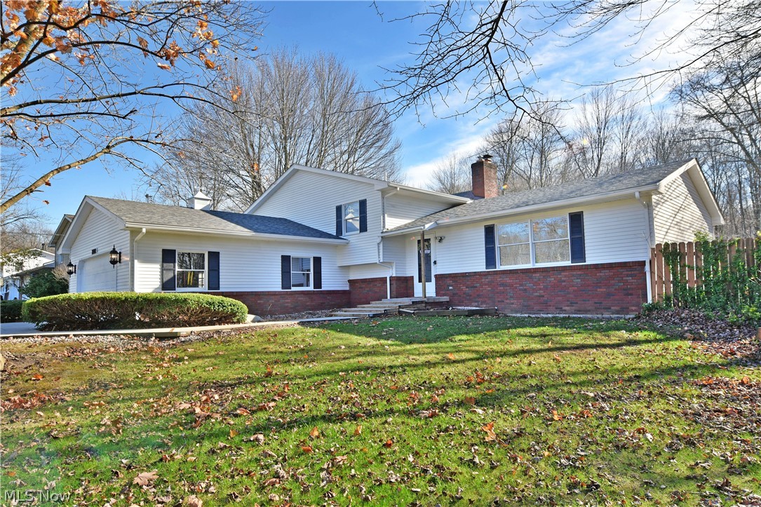 Move in before the snow flies! This stunning 4 bedroom, 3 bath home is nestled in a low traffic neighborhood in Lakeview School District. As you pull into the concrete drive, the gorgeous, freshly painted home with a brand new roof greats you with a country like yard, wooded lot next to you and a 3 car garage. You have access from the garage to the laundry room and office space that could be used as additional possibilities. From the front door you meet the newly updated home. This whole home has been professionally painted and brand new flooring throughout. The large living room flows into the updated kitchen/ dining area that opens up to the backyard with the large wooden deck and above ground pool. From the main floor, the upper level has the four bedrooms and full bath or you can go downstairs to an additional family room/ rec room with a brick fireplace and another 1/2 bath. It doesn't end there you also have another 648 sq ft of basement that contains a pool table for additional
