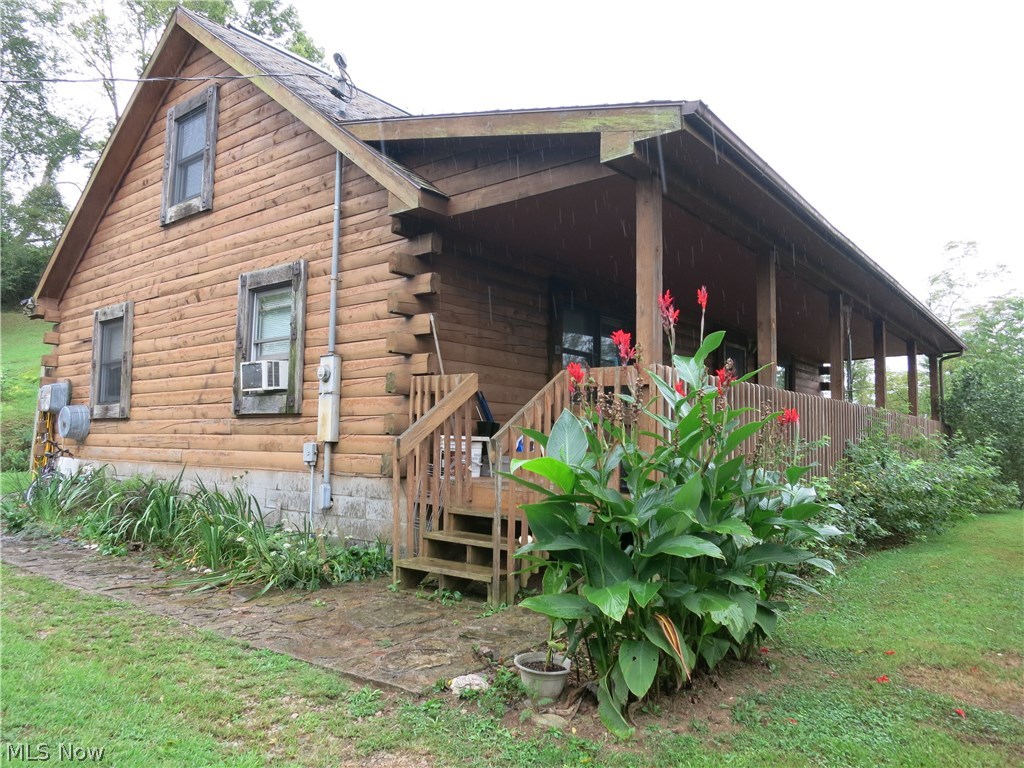Quintessential log cabin on the river. Covered front porch, side deck for entertaining and cookouts, river view, 2 bedrooms, two full baths and a loft area for extra sleeping quarters when needed, all situated on a 2.45 acre river lot. Out of the flood plain.