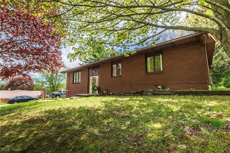 If you're looking for move in ready in Green school district, then this is the home for you. From when you first walk in through the front door, you will notice the brand new carpet with the modern chandelier hanging above. You will be amazed with how much living space this home has to offer on the first floor along with the lower half. Open eat in kitchen with new flooring and countertops. The kitchen overlooks the very spacious backyard and deck. Three bedrooms are on the first floor and the fourth being on the lower floor. Downstairs, there is another family room or office space with a second fireplace, perfect for those relaxing nights. This home is tucked away in a quiet neighborhood in Uniontown. Did I mention that this home also has a brand new roof and as a bonus my sellers are offering a one year home warranty just for your peace of mind. Come check this home out before its gone !