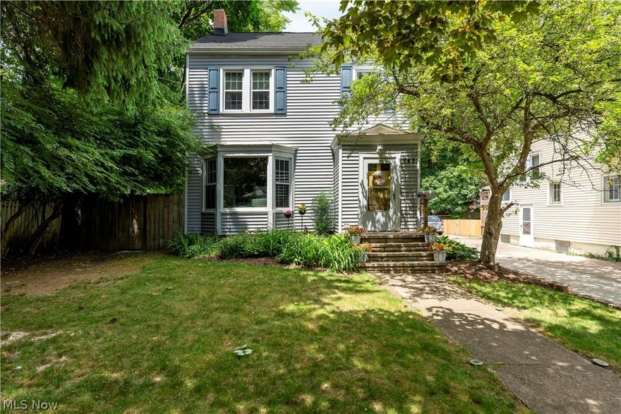 Welcome home to 745 Wellesley Ave in Highland Square (Akron)! You will immediately appreciate the curb appeal this home has to offer as soon as you pull into the drive. Home is nestled on a brick road with plenty of mature trees for shade.  Front entryway immediately welcomes guests to your century home. Hardwood floors are carried throughout most of the home. Off the entryway, you will find a spacious living room with bay window and non-functioning decorative fireplace that flows into the dining room. Dining room is nice sized with slider that leads to the deck, patio, and back yard. Kitchen features ceramic tile, appliances, and white cabinets. There are a few steps down to the landing that leads to your side door/driveway. Continue downstairs to the full basement where your laundry room, storage space, and a half bathroom are located. Basement has been fully waterproofed and also features a battery sump pump. Between the kitchen and living room you will find a staircase that leads to all 3 bedrooms, and full bath. Loft bed to stay! This home offers a detached 2 car garage with electric (has its own panel), fridge (stays) and storage area. Back yard is decent sized, is pretty private, and offers a swingset to stay with the home. You won't want to miss this gem, call for your private showing before it's SOLD!