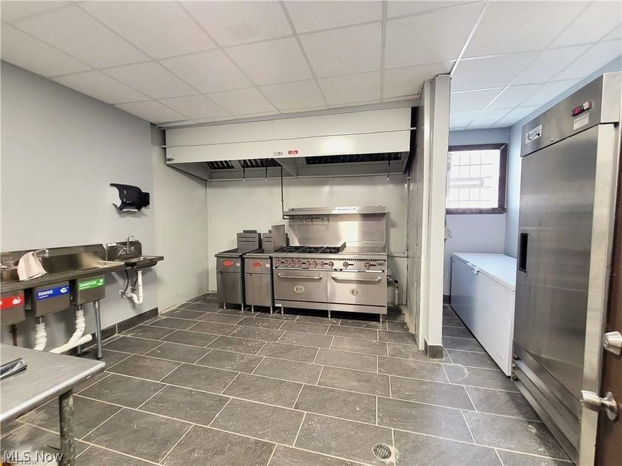 Looking for a new location for your culinary business? Well, here's your new kitchen space! Located inside the historic Finn Café, on Broadway Ave., in Cleveland's Slavic Village! The building has been renovated and the bar is open and serving! The patrons are simply waiting for your cuisine! The all new kitchen equipment includes: six burner range w/double oven and griddle, 2-deep fryers, fridge, large chest freezer, sinks, and stainless-steel workstation. The kitchen license is already active and includes catering services, if so inclined. If you have a culinary business with a proven track record, then you've found your new home. Please Note: This is a KITCHEN LEASE. The entire building is not available to lease. Call to schedule your private showing.