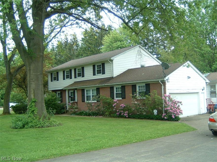 WHAT A FIND! One owner, custom built. Deceiving, 4/5BR, 2 1/2BA, Two Story Colonial with a separate, in-home office/shop/studio with its' own exterior door. 3,500 sq.ft. of living space. Alum/Brick exterior. Beautiful 116x171, treed lot. Hidden away on a private, low-traffic, dead-end street. Concrete driveway. Attached double garage. Shed. Foyer entry w/guest closet and staircase to the 2nd floor. LR. Formal DR. Cherry wood Kitchen with center-island, all appliances included, custom cabinetry with plenty of storage, open to cheery 13x16 breakfast room. FR with built-in bar. Half bath. Rear hallway. Den/5th BR with wood burner. Separate in-home office/studio/shop with ceramic tile floor and separate door out to the driveway. Laundry hook-ups on the first floor. Functional floor plan. Spacious BR's on the 2nd floor. MBR with built-ins, closet space and on-suite bath. Another full bath with Jack n' Jill sinks on the 2nd floor. Basement with a large, paneled Rec Room with bar. Loads of st