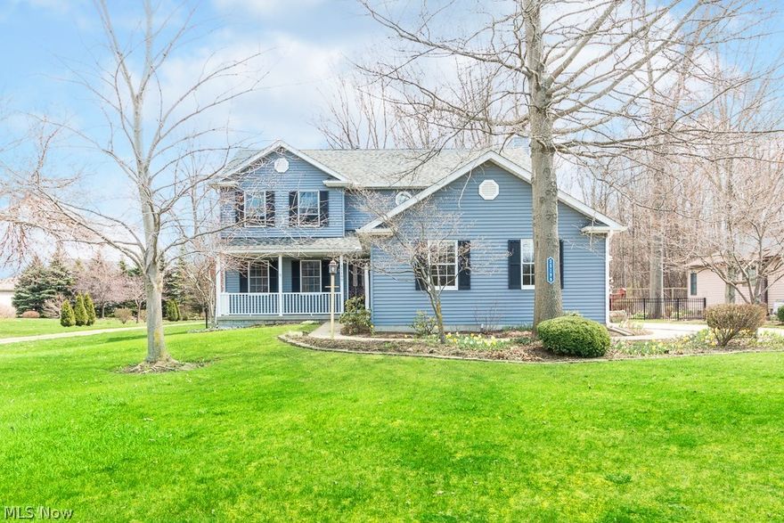 Pride of ownership!  Come check out this immaculate colonial on a park-like setting lot w/ a 2+ car side load garage.  Walk up to the covered front porch and enter into the foyer that has hardwood floors that flow throughout most of the first floor.  Off of the foyer is the living & dining room combo with a huge bay window for gorgeous views of the backyard and tons of natural light.  Walk thru to the large eat in Kitchen that has tons of cabinets for storage and hard surface countertops of work area.  Completely open to the Great Room that has a beautiful brick fireplace with built-ins on each side and a sliding patio door that walks out to the giant deck - great for entertaining.  A separate laundry room and full bathroom wrap up this main floor.  Walk up the extra wide staircase and enter the master suite with a vaulted ceiling, new carpet, walk-in closet and a private bathroom that features high ceilings, 2 sinks and a jetted tub.  2 additional very large bedrooms with nice sized c