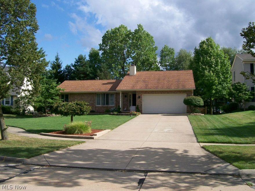 Once you step inside this home, the warmth and beauty will make you forget the cold outside.  The decor is very appealing.   Step into the foyer leading to the openness of the living room, dining room and eat-in kitchen.  Great floor plan with the master bedroom off to one side and the remaining 2 bedrooms on the other side.  The eat-in kitchen has black granite counter tops, wood laminate flooring & includes all appliances.  The master bath has a large tub with a separate shower stall. Both baths remodeled with corian counters and sinks.  Walk thru the glass doors to the finished basement that boasts 2 finished rooms, a large utility room, a large storage room and glass block windows.  Not that it is needed, but there is also a pull down stair in the garage for additional storage.   Large deck off the back enclosed by a fully fenced yard for privacy.  All situated on a cul de sac lot for additional privacy.  The furnace is 2 years old; windows 5 years (with transferable warranty); and